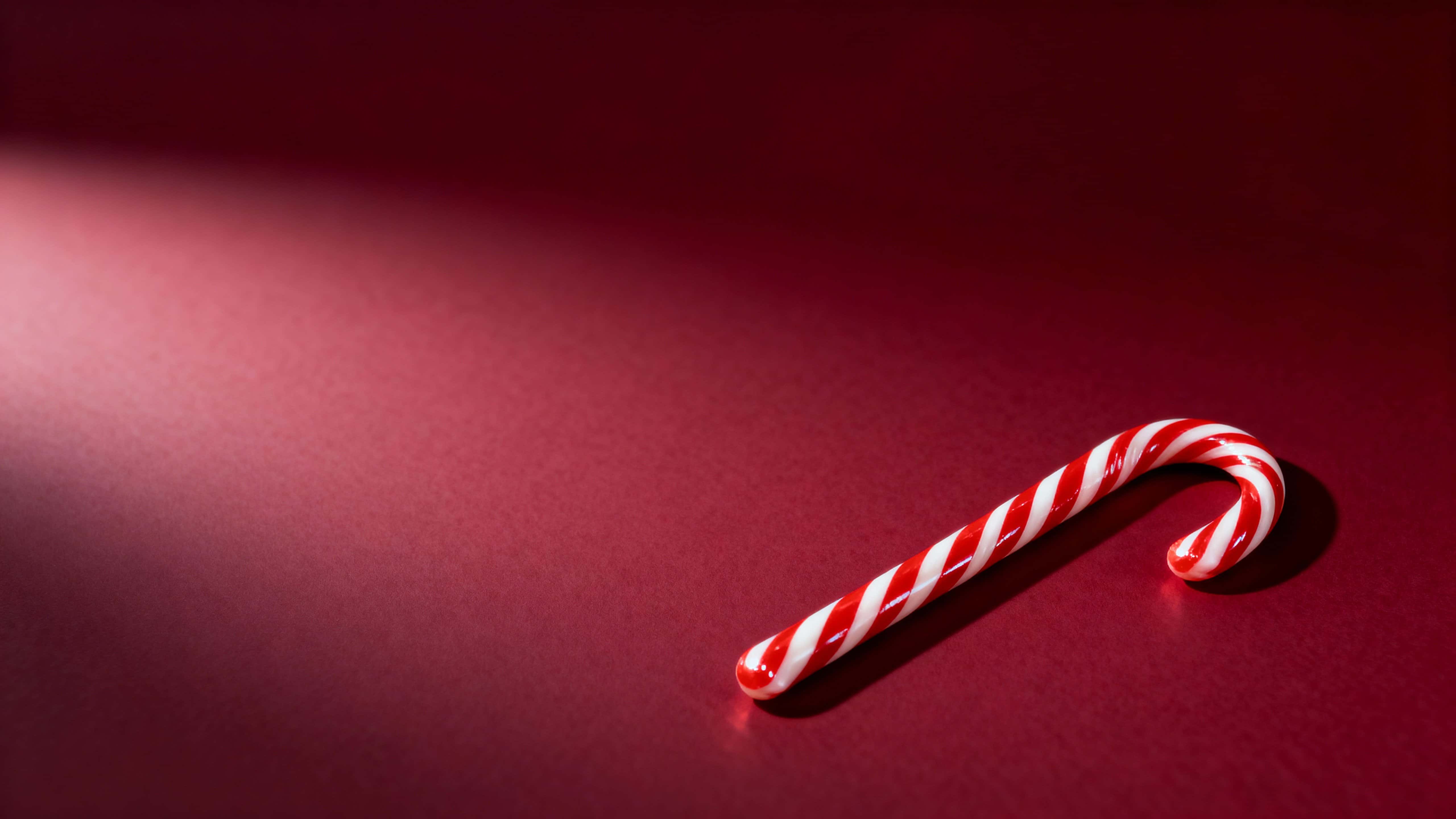 Ruby Cane Candy cane on ruby red background — Free 5120x2880 AI Image & Prompt ...